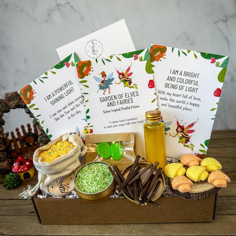 Little hands and nature Mindful Potion Play Kit with flowers, displaying various items like potion cards and ingredients with a wooden spoon.