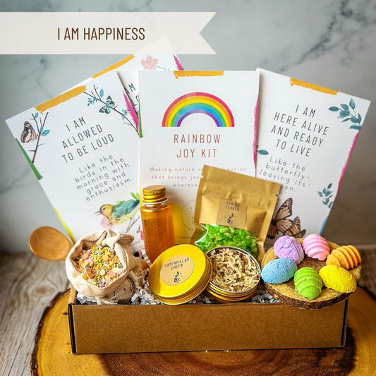 Rainbow Joy Kit with various items: Stardust Rainbow, Magic Eggs, Spring Leaves, Caterpillar Cheer, Liquid Carrot, Wood Spoon
